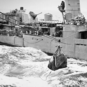 KOREAN WAR: NAVY MAILBAG. Mailbag sent along the highline from the naval destroyer U. S. S. Cowell off the coast of Korea. Photographed 1953