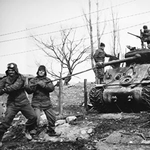 KOREAN WAR: TANK, 1951. The crew of an Allied tank uses a lull in fighting near the Korean central front north of Wonju, to clean weapons, 15 February 1951
