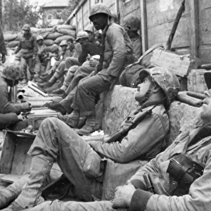 KOREAN WAR: U. N. TROOPS. Exhausted United Nations troops take a rest during a lull in fighting near Seoul, South Korea, September 1950