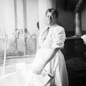 LAUNDRESS, c1918. An African American laundress with a washtub. Photograph, c1918