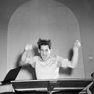 LEONARD BERNSTEIN (1918-1990). American composer and conductor. At Carnegie Hall in New York City