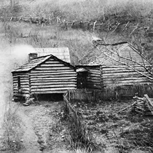 LOG CABIN, c1909. The home of a moonshine maker in rural America. Photograph, c1909