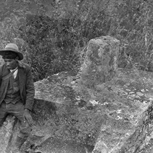 MACHU PICCHU, 1916. Benigno, a Peruvian worker, photographed, 1916, at Intihuatana