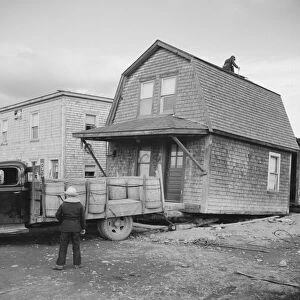 MAINE: MOVING, 1940. Moving a house in Fort Kent, Maine. Photograph by Jack Delano