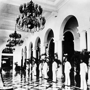 MANILA: HOTEL, 1925. Bellhops in the lobby of the luxury Manila Hotel, built, 1912