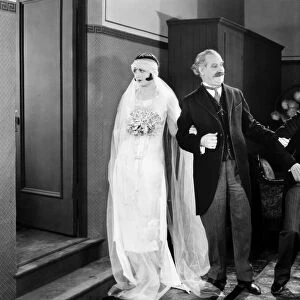 HIS MARRIAGE WOW, 1925. Natalie Kingston, William McCall, and Harry Langdon