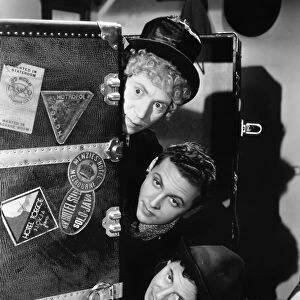 THE MARX BROTHERS, 1935. Harpo Marx, Allan Jones, and Chico Marx in A Night at the Opera, 1935