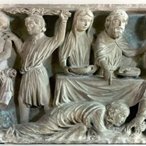 Mary Magdalene washes Jesus feet with her hair. Stone relief, Burgundy, France, 13th century