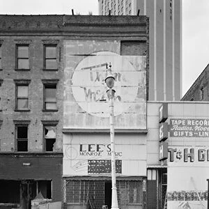 MICHIGAN: DETROIT, c1980. Abandoned storefronts along Monroe Avenue in Detroit, Michigan
