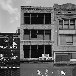 MICHIGAN: DETROIT, c1980. Abandoned storefronts along Monroe Street in Detroit, Michigan