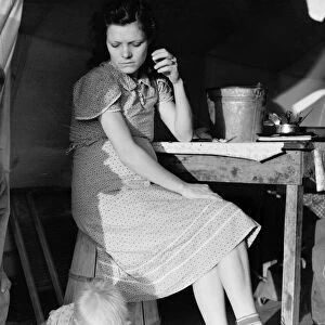 MIGRANT CAMP, 1939. A daughter and son of an ex-tenant farmer from Oklahoma living