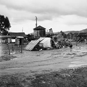 MIGRANT CAMP, 1939. A Mexican migrant familys camp near Strathmore, California