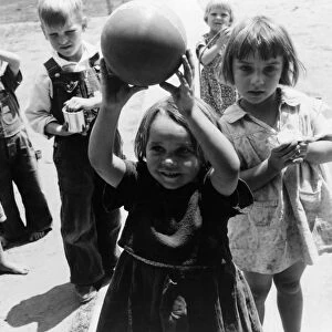 MIGRANT CHILDREN, 1939. Children playing in nursery school at a camp for migrant workers