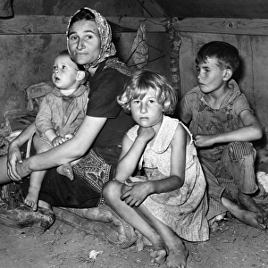 MIGRANT MOTHER, 1939. A migrant mother and her children photographed at Weslaco