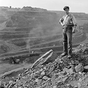 MINNESOTA: IRON MINE, 1941. Miner standing at at one end of the Hull-Rust-Mahoning iron pit