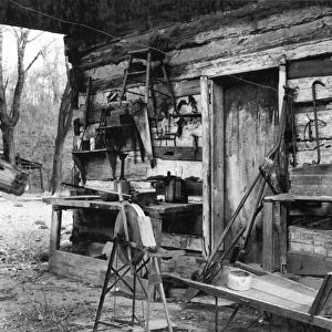 MISSOURI: TOOL SHED, 1936. A farm tool shed converted from a log cabin on Watson homestead