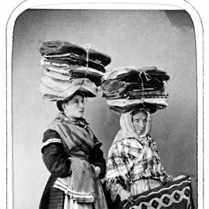 NAPLES: PEASANTS, 1869. A pair of peasant women of Naples, Italy, with carpet bundles