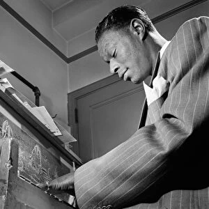 NAT KING COLE (1919-1965). American musician. Photograph by William P. Gottlieb, c1947