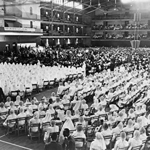 NATION OF ISLAM, 1964. Elijah Muhammad leading an assembly of Nation of Islam adherents