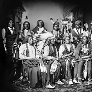 NATIVE AMERICAN DELEGATION, 1877. Delegation led by Oglala Sioux chief Red Cloud. Standing - Red Bear, Young Man Afraid of his Horse, Good Voice, Ring Thunder, Iron Crow, White Tail, Young Spotted Tail. Seated - Yellow Bear, Jack Red Cloud, Big Road, Little Wound and Black Crow. Photographed by Mathew Brady, 1917