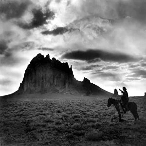 NAVAJO MAN, c1915. The Dawn of the Day. A Navajo man on horseback, gesturing toward a butte in the southwestern United States. Photograph by William Carpenter, c1915