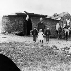 NEBRASKA: SETTLERS, 1887. Homesteader George Barnes and his children in front of