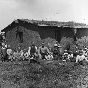 NEBRASKA: SETTLERS, 1888. A homesteader family with friends in front of their sod