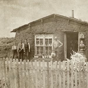 NEBRASKA: SETTLERS, c1886. Family of homesteaders standing in front of their sod