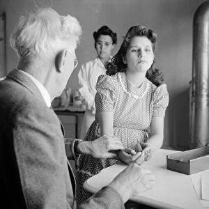 NEW MEXICO: HEALTH CLINIC. Dr. Werner Onstine examining a patient at a clinic operated