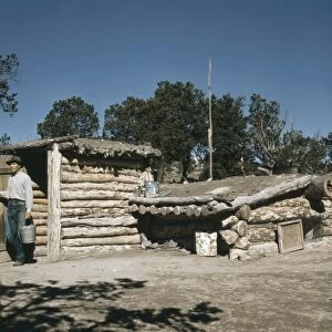 NEW MEXICO: PIE TOWN, 1940. Mr. Leatherman, homesteader, coming out of his dugout