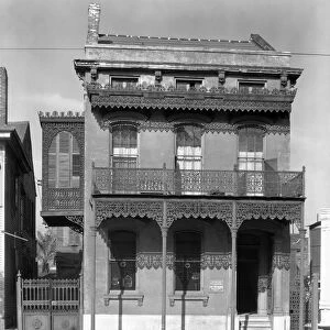 NEW ORLEANS: HOUSE, 1936. Cast iron grillwork house near Lee Circle on Saint Charles Avenue