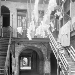 NEW ORLEANS: SONIAT HOUSE. Laundry drying on clotheslines in the courtyard of the