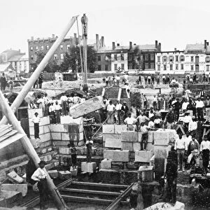 NEW YORK: ALBANY, c1869. Construction workers at laying the granite foundation