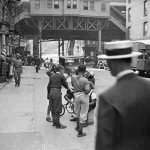 NEW YORK CITY, 1938. Boys on the street in Harlem, New York City. Photograph by Jack Allison