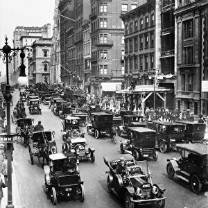 NEW YORK CITY: TRAFFIC, c1910. Carriage and automobile traffic along 5th Avenue