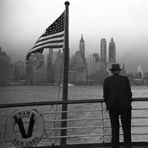 NEW YORK HARBOR, 1941. Lower Manhattan seen from the S. S. Coamo leaving New York City. Photograph by Jack Delano, December 1941