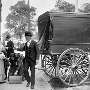 NEW YORK: IMMIGRANTS, c1900. Immigrants at Battery Park in New York City. Photograph