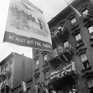 NEW YORK: MOTT STREET, 1942. A flag raising ceremony on Mott Street in New York City