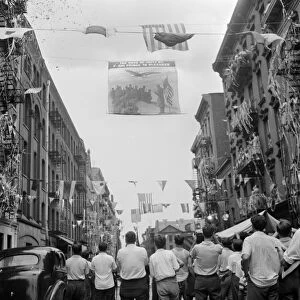 NEW YORK: MOTT STREET, 1942. A flag raising ceremony on Mott Street in New York City