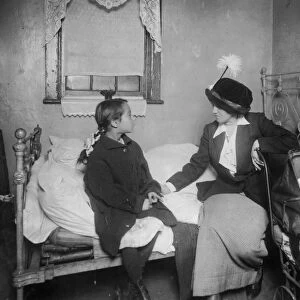 NEW YORK: TENEMENT, 1913. Investigator talking with Ida List, eight year old child