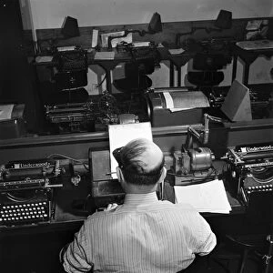 NEW YORK TIMES OFFICE, 1942. A telegraph operator receiving Western Union dispatches