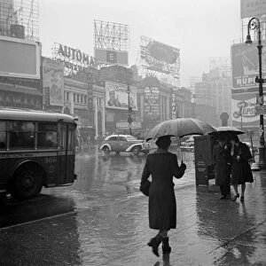 NEW YORK: TIMES SQUARE. A rainy day in Times Square, New York City. Photograph by John Vachon