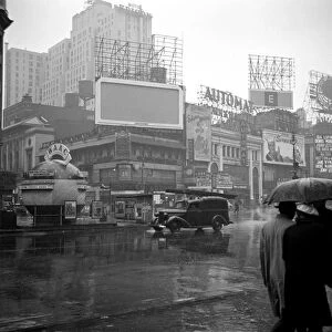NEW YORK: TIMES SQUARE. A rainy day in Times Square, New York City. Photograph by John Vachon