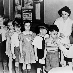 NEW YORK: VACCINATION. Children in line to be vaccinated in New York City. Photograph