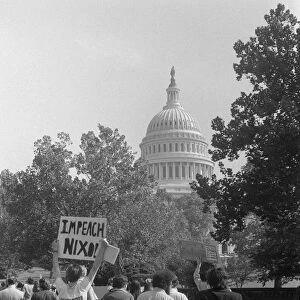 NIXON PROTEST, 1973. Protesters carrying an Impeach Nixon sign near the United