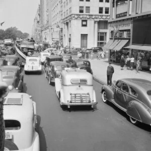 NYC: FIFTH AVENUE, 1939. Traffic on 5th Avenue near 57th Street in New York City