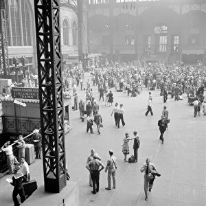 NYC: PENN STATION, 1942. Passengers in the concourse at Penn Station in New York City