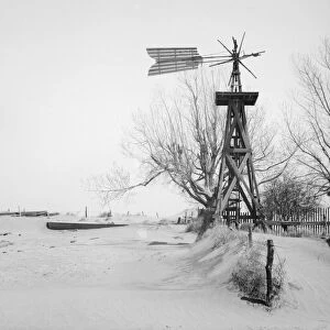 OKLAHOMA: FARM, 1936. A windmill and tank on an abandoned farm in Cimarron County, Oklahoma