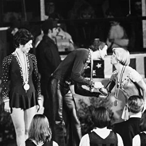 OLYMPIC GAMES, 1976. Alexander Gorshkov of the Soviet Union, winner of the gold medal, with partner Lyudmila Pakhomova (left), in the ice dancing competition at the Winter Olympic Games in Innsbruck, Austria, kisses Colleen O Connor of the United States, who has been awarded the bronze medal with partner Jim Millns (right), 9 February 1976