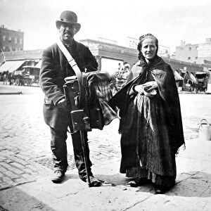 ORGAN GRINDER, 1897. An organ-grinder and his wife in New York City, 1897